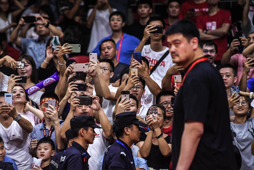Fans snap photos of Yao Ming, former NBA player and current president of the Chinese Basketball Association, during a match between China and South Korea at the 2019 FIBA World Cup in Guangzhou, Guangdong province, Sept 6, 2019. Liu Jialiang/IC
