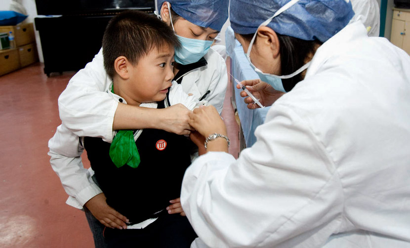 A boy receives an injection in Shanghai, 2009. Zhang Dong for Sixth Tone