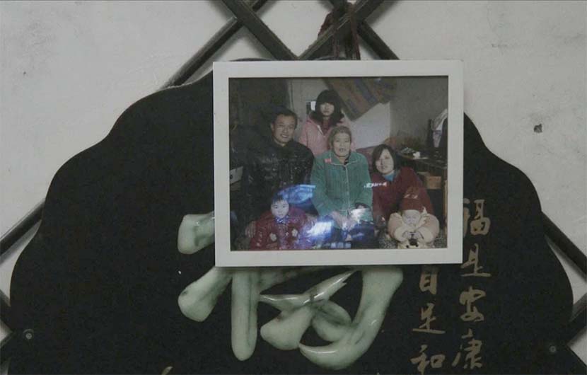 A framed photo from a family dinner in April. Courtesy of Zhu Shengze