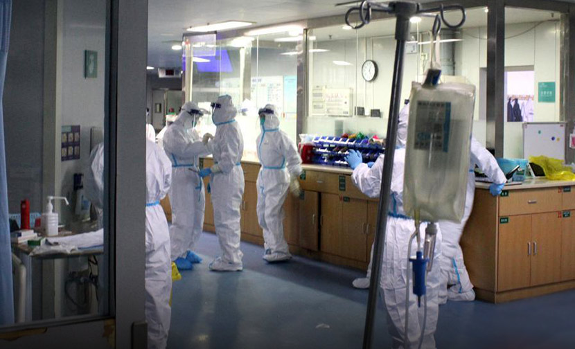 Doctors and nurses in full protective suits at Zhongnan Hospital in Wuhan, Hubei province, Jan. 25, 2020. Zhou Qunfeng/CNS