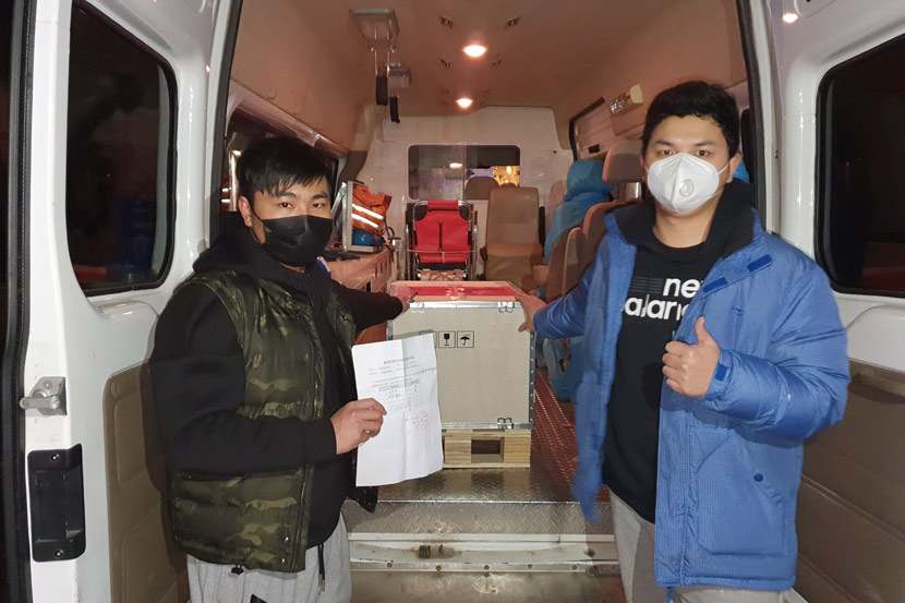 Volunteers pose for a photo while transporting medical supplies in Xiaogan, Hubei province, 2020. Courtesy of Guo Fei’s volunteer group