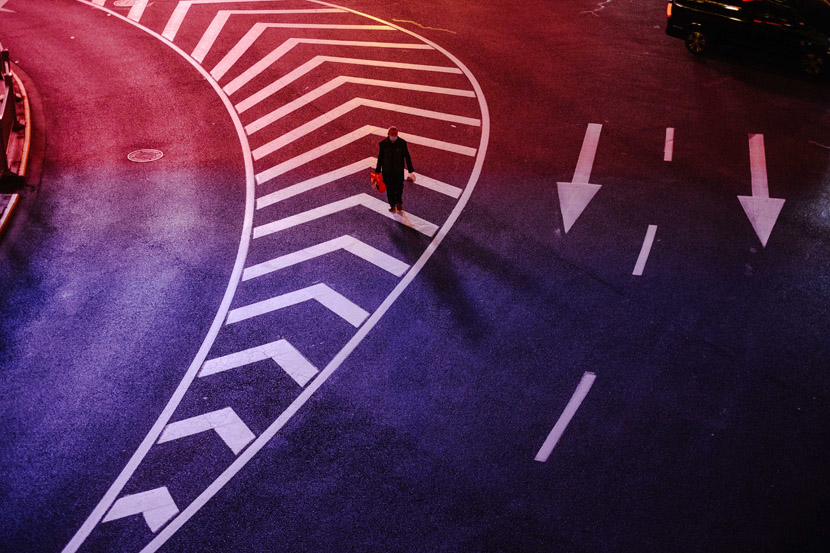 A man stands in the middle of a deserted street in Shanghai, Wu Huiyuan/Sixth Tone