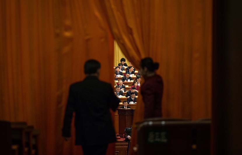A delegate enters the Great Hall of the People in Beijing to attend a meeting during the “two sessions,” March 8, 2018. EPA/Roman Pilipey/IC