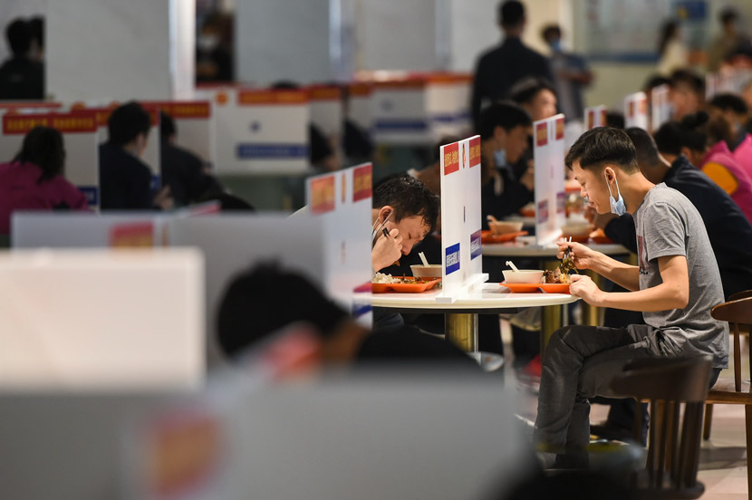 Foxconn’s employees have lunch separately at work in Shenzhen, Guangdong province, March 2020. IC