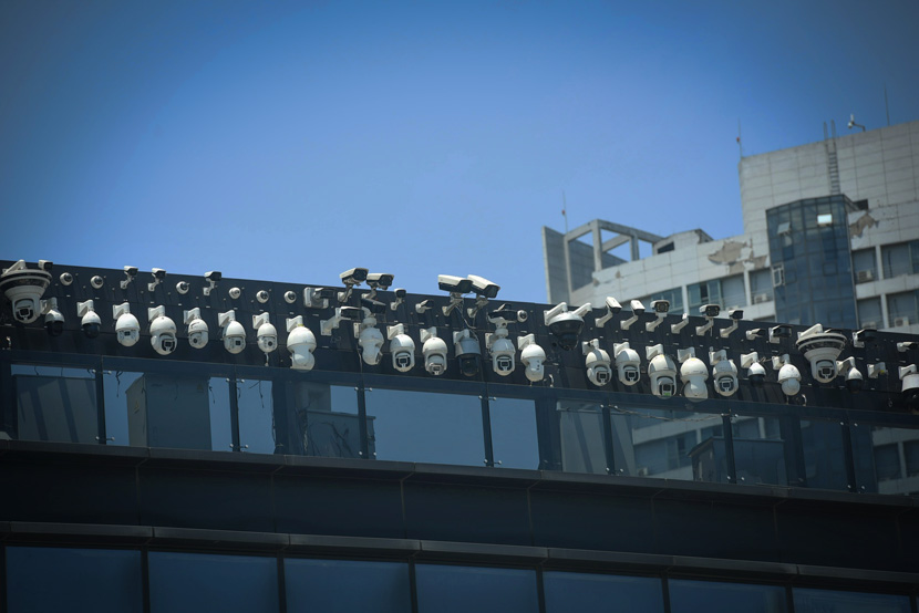 Lines of surveillance cameras can be seen on a building in Hangzhou, Zhejiang province, May 29, 2019. Long Wei/IC