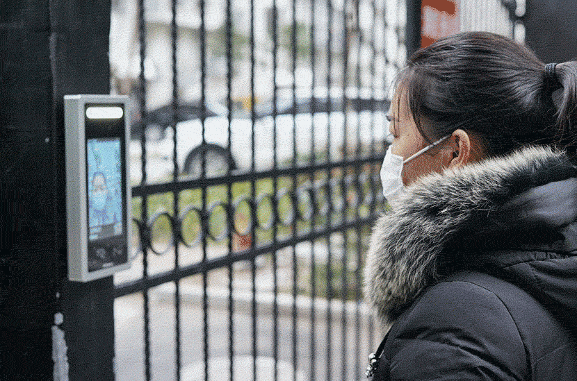 A GIF shows residents using an entry system that can identify them even when wearing face masks and detect their health condition in Hangzhou, Zhejiang province, March 3, 2020. Cai Zixin/CNS