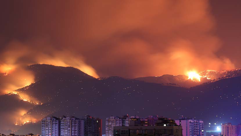 A forest fire rages near Xichang, Sichuan province, March 31, 2020. Eighteen firefighters and one guide were killed battling the blaze. Xinhua