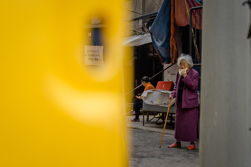 A woman enjoys a snack in Wuhan, Hubei province, March 22, 2020. Gerry Yin/Wild Photos
