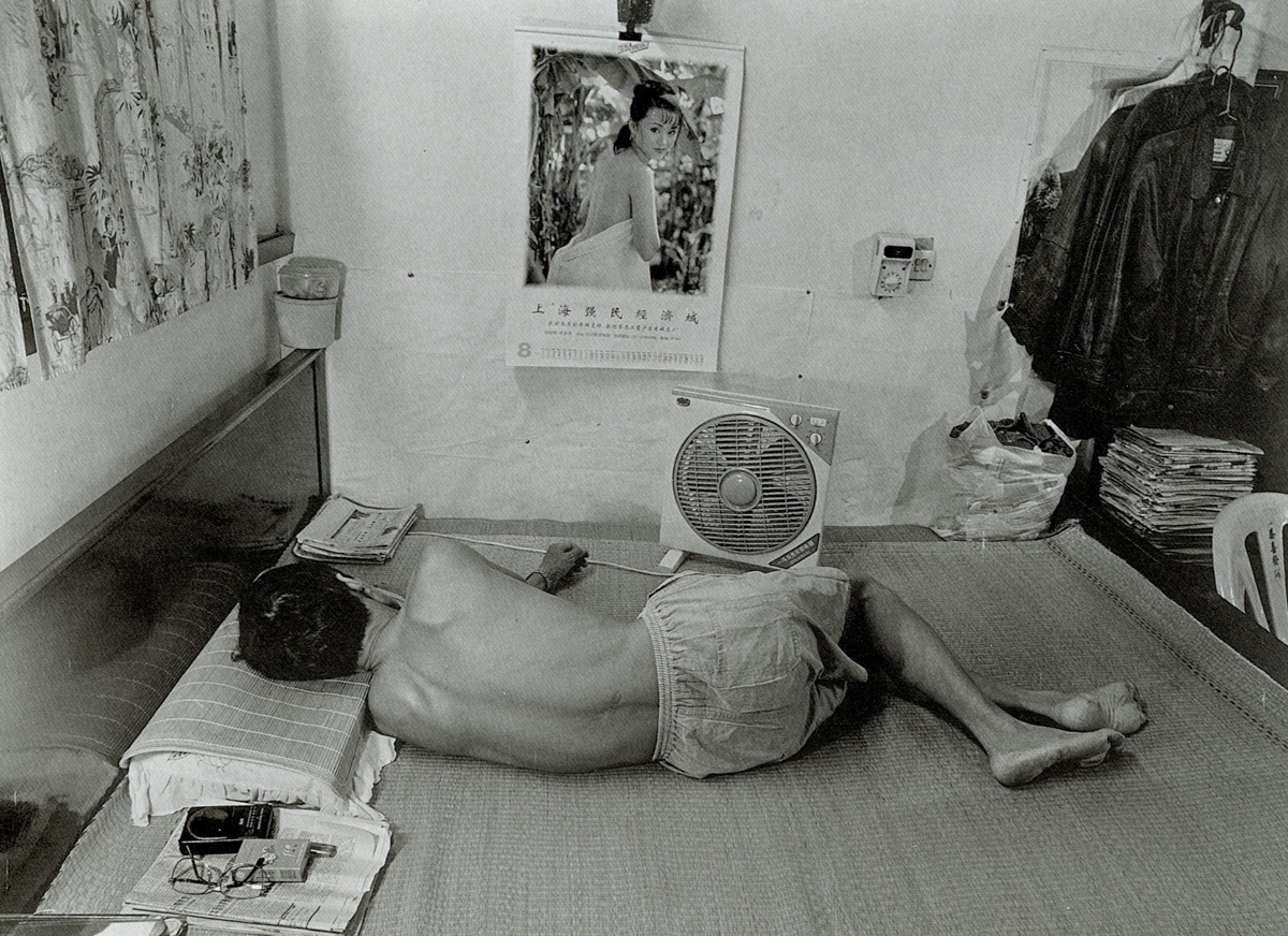 A man naps on a hot day on Dongning Road, Shanghai, 1998. Courtesy of Wu Jianping