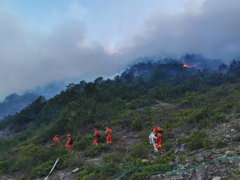 Firefighters head toward a forest fire along the border of Xide and Mianning counties in Sichuan province, May 8, 2020. People Visual