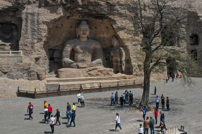 Tourists visit the Yungang Grottoes in Datong, Shanxi province, May 13, 2020. Wu Junjie/CNS/People Visual