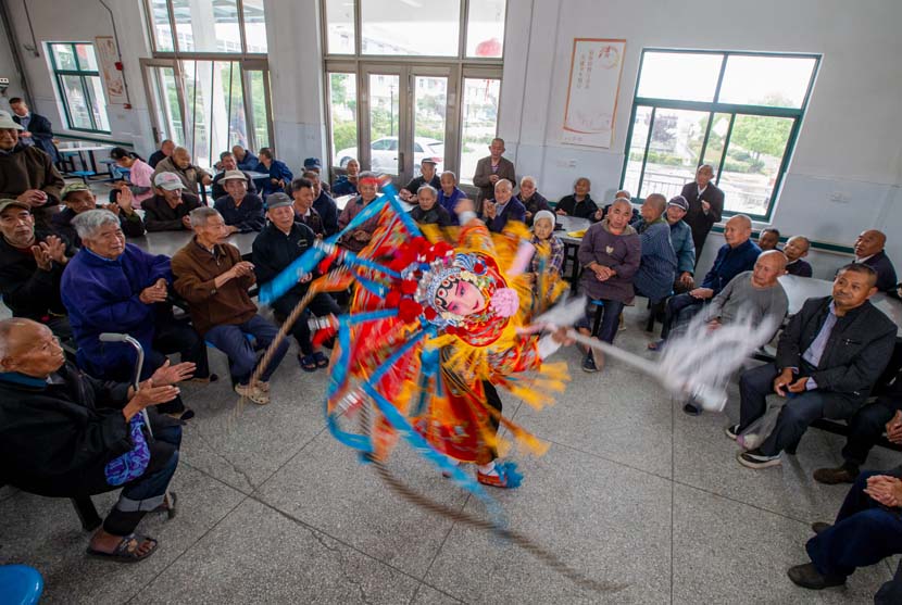 Students from a local primary school perform Beijing opera at a nursing home in Hai’an, Jiangsu province, May 30, 2020. People Visual