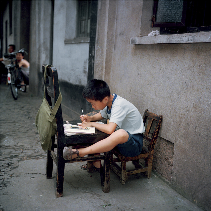A boy does his homework in Suzhou, Jiangsu province, 1981-1982. Courtesy of Ryoji Akiyama via Seisodo