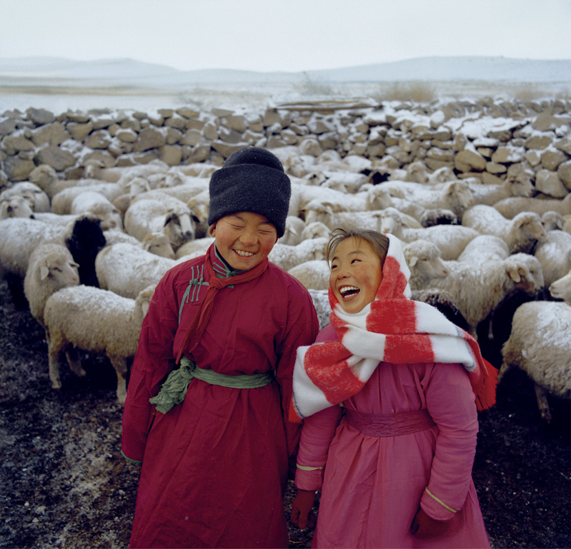 Children pose with a flock of sheep, Inner Mongolia Autonomous Region, 1981-1982. Courtesy of Ryoji Akiyama via Seisodo