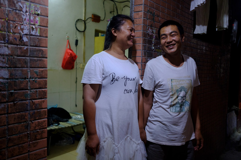 Zhang Yayun and her husband Tang Dongdong pose for a photo in front of their rental apartment in Longtan Village, Guangzhou, Guangdong province, April 30, 2020. Wu Huiyuan/Sixth Tone