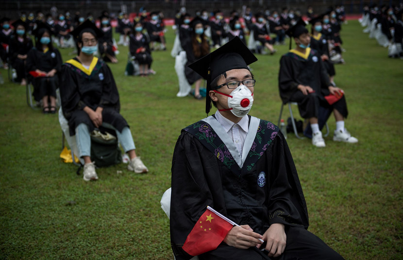 Students attend their graduation ceremony at Wuhan University, June 20, 2020. Don MCcurren/IC
