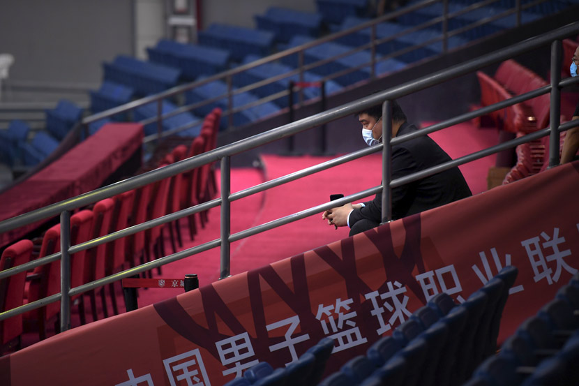Yao Ming, chairman of the Chinese Basketball Association, watches a game in Qingdao, Shandong province, June 20, 2020. Li Ziheng/Xinhua