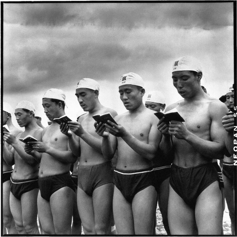 Swimmers read “The Little Red Book” of Chairman Mao quotations before beginning their journey in the Songhua River during the second anniversary of Chairman Mao’s swim across the Yangtze River, in Heilongjiang province, June 16, 1968. Li Zhensheng/The Chinese University of Hong Kong Press