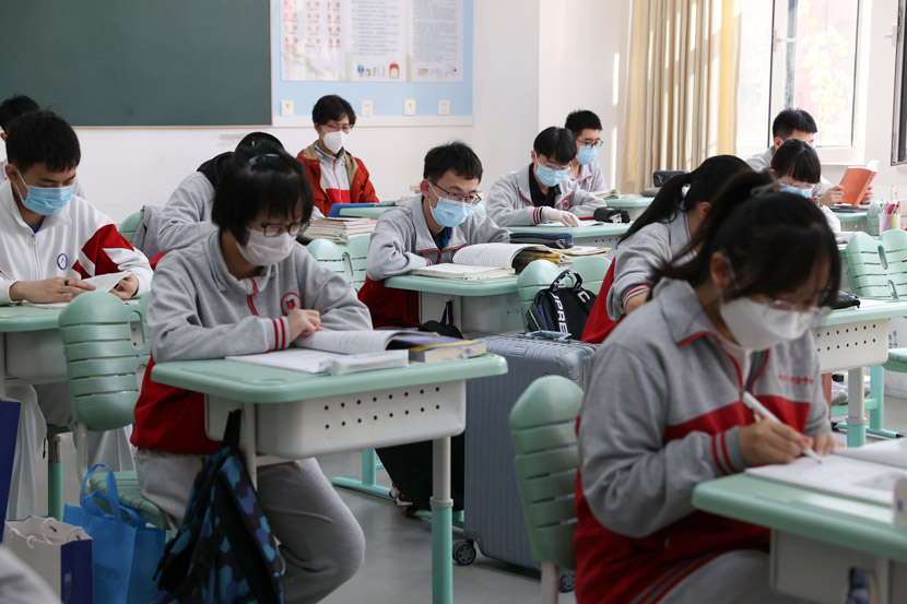 Students wearing masks study at a high school in Beijing, April 27, 2020. Jiang Qiming/CNS/People Visual