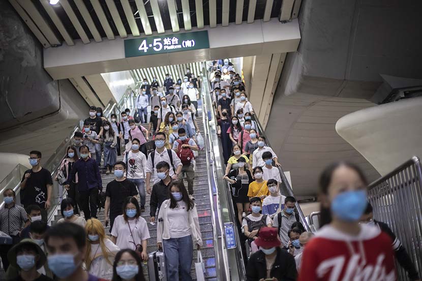 Passengers arrive at a subway station in Guangzhou, Guangdong province, May 4, 2020. People Visual