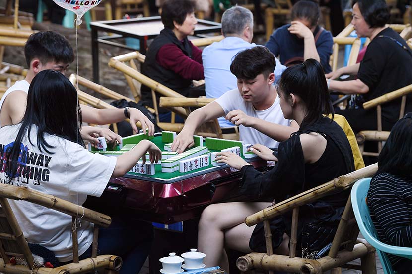 People play mahjong at a park in Chengdu, Sichuan province, April 7, 2020. People Visual