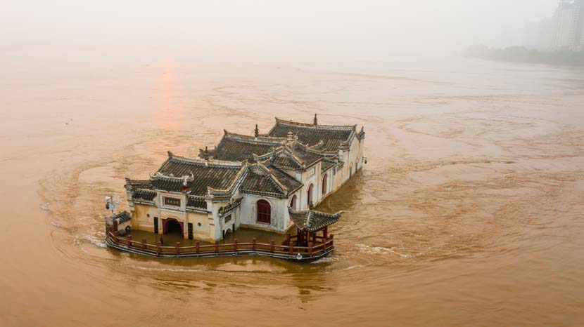 Floodwaters surround the 700-year-old Goddess of Mercy Pavilion in Ezhou, Hubei province, July 10, 2020. Zhang Hongbing/People Visual