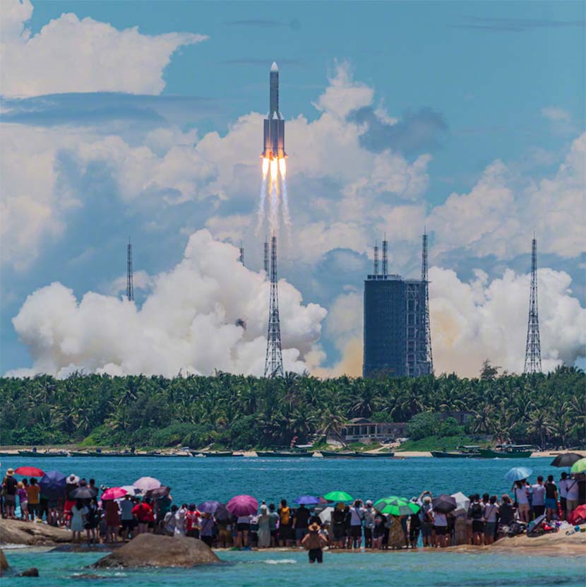 People watch the launch of China’s Tianwen-1 Mars mission at the Wenchang Space Launch Center in Hainan province, July 23, 2020. Yu Jun for Sixth Tone