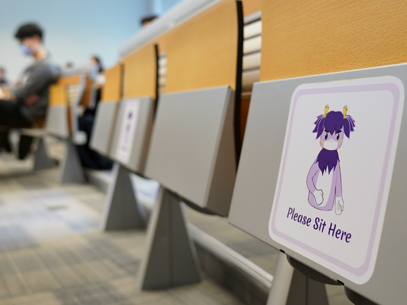A sign showing Qilin, the NYU Shanghai mascot, wearing a mask reminds students to socially distance in a classroom at the university’s main building in Shanghai, April 27, 2020. Courtesy of NYU Shanghai