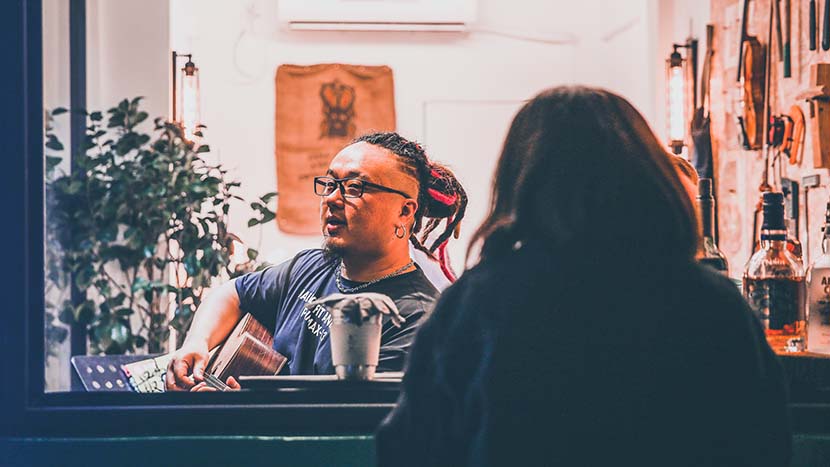 Tang Jiamin sings a song to a customer at the Story Store in Yuyuan Road, Shanghai, June 23, 2020. Courtesy of Tang Jiamin