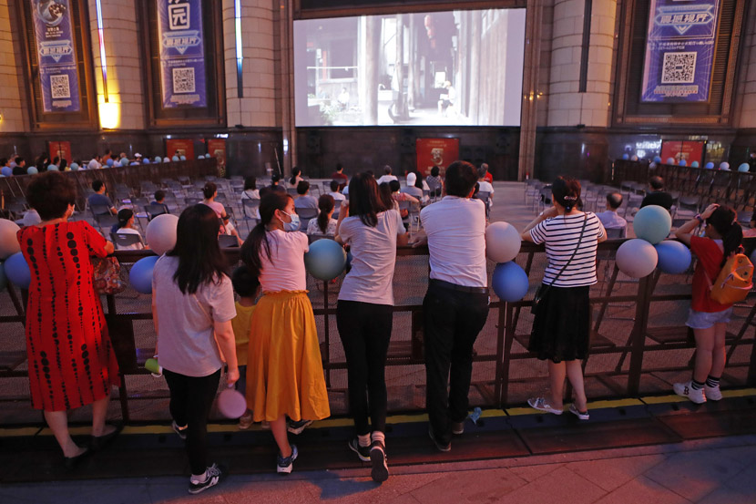 People watch a movie outdoors during the Shanghai International Film Festival, July 27, 2020. Yin Liqin/CNS/People Visual