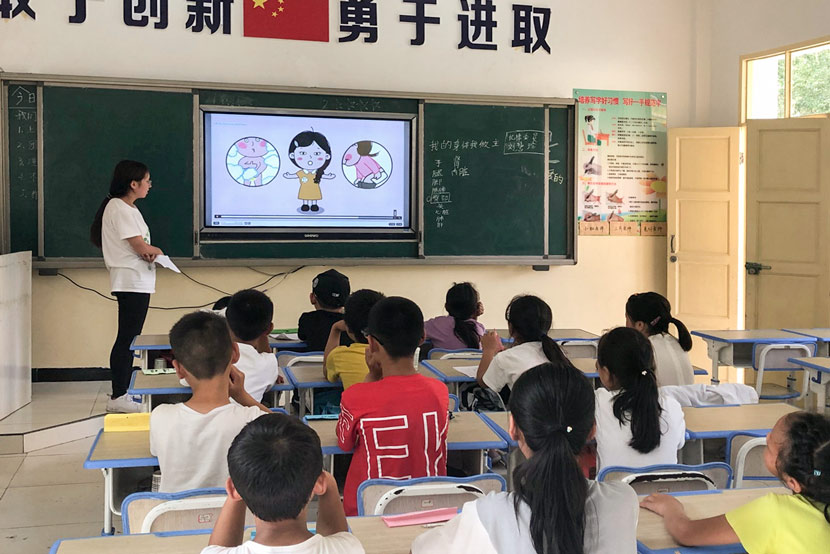 A teacher gives a sex education class at a rural primary school in Kang County, Longnan, Gansu province, July 29, 2019. Chen Bohan for Sixth Tone