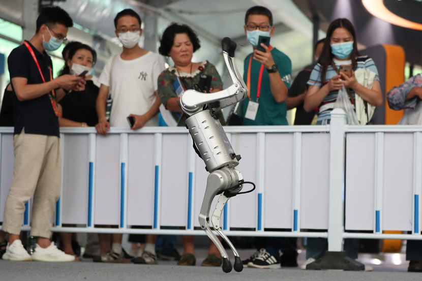Visitors photograph a robot dog at the China International Fair for Trade in Services in Beijing, Sept. 7, 2020. People Visual