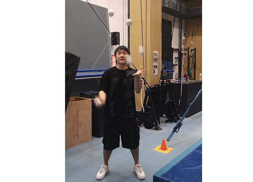 He Weiguo demonstrates his juggling skills backstage at the Xintiandi Group Sun Theater in Hangzhou, Zhejiang province, July 8, 2020.