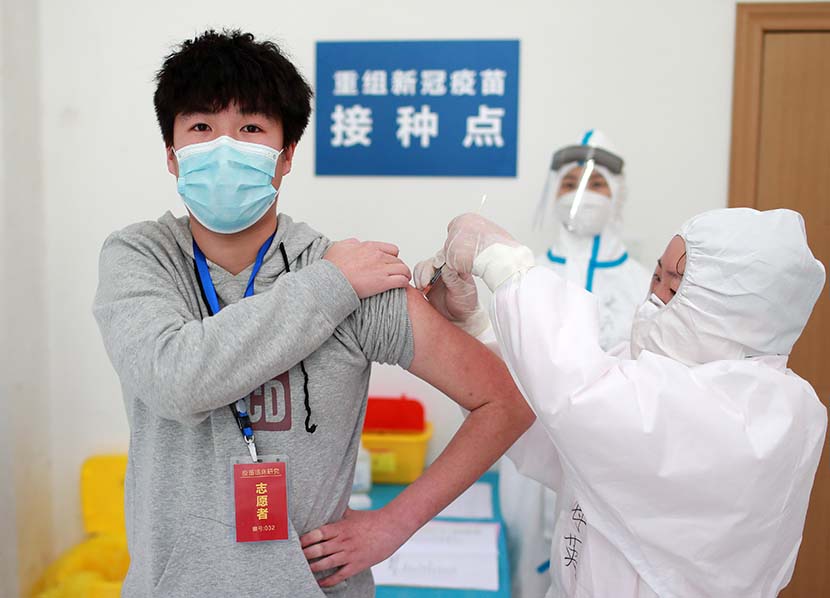 A volunteer is injected with an experimental coronavirus vaccine in Wuhan, Hubei province, April 15, 2020. People Visual