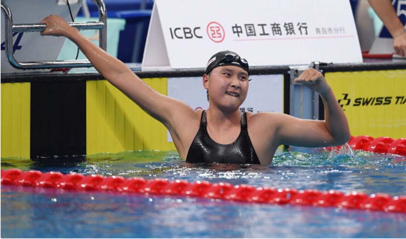 Wang Jianjiahe gives a fist pump after setting national and Asian records in the 1,500-meter freestyle event at the 2020 Chinese National Swimming Championships in Qingdao, Shandong province, Sept. 27, 2020. Tao Xiyi/Xinhua
