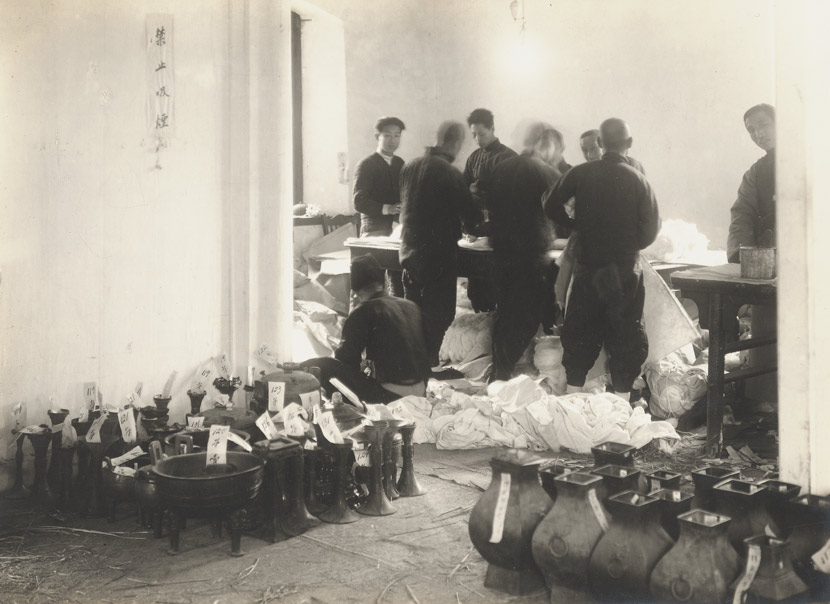 Palace Museum staff box up artifacts in the Forbidden City, Beijing, 1930s. Courtesy of the Palace Museum