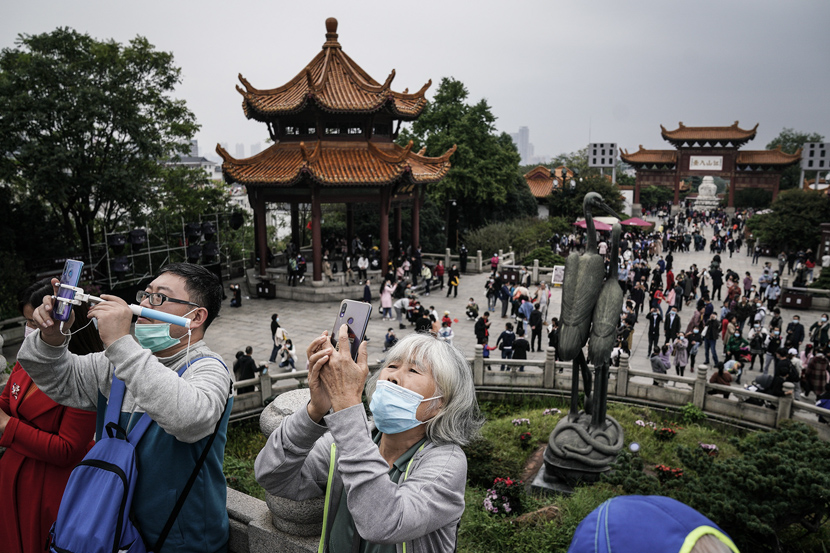 Visitors take in the sights at Yellow Crane Tower in Wuhan, Hubei province, Oct. 9, 2020. Zhang Muzhi/IC