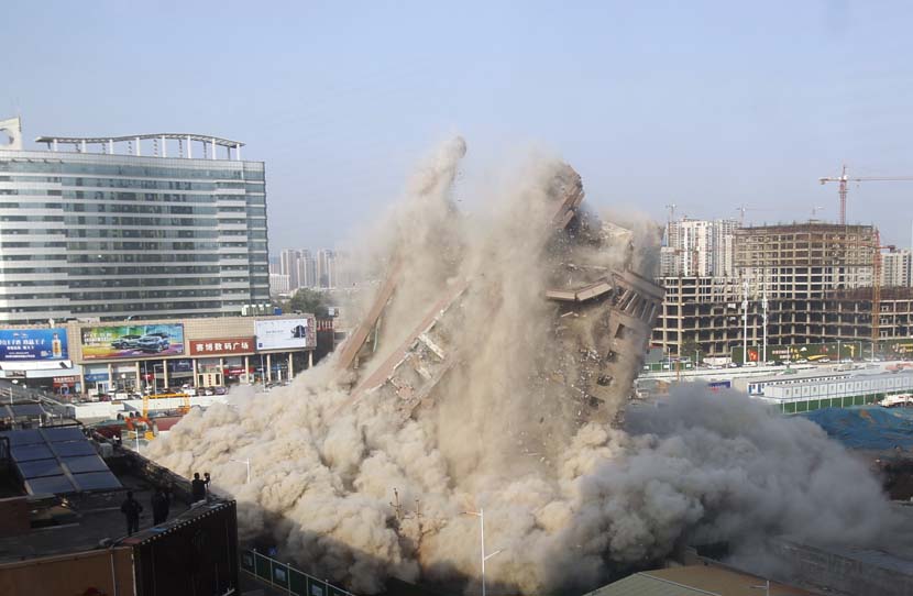 An old building is blasted in Zhengzhou, Henan province, Oct. 31, 2020. People Visual