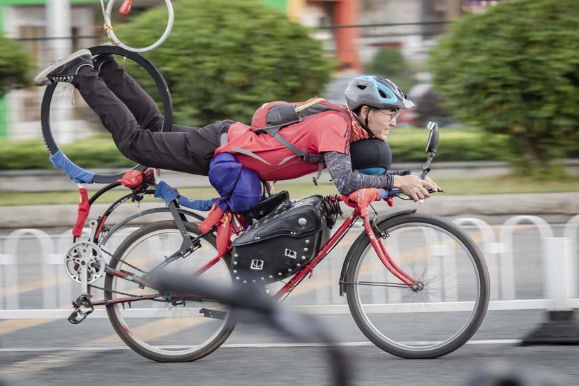 A delivery driver rides on his modified bicycle in Guangzhou, Guangdong province, Oct. 27, 2010. People Visual