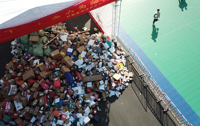 Packages are piled up beside a school playground at Zhejiang University in Hangzhou, Zhejiang province, Nov. 15, 2019. People Visual