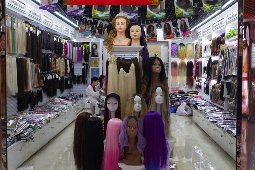 Wigs are displayed at a store in Yiwu, Zhejiang province, Oct. 17, 2020. Wu Peiyue for Sixth Tone
