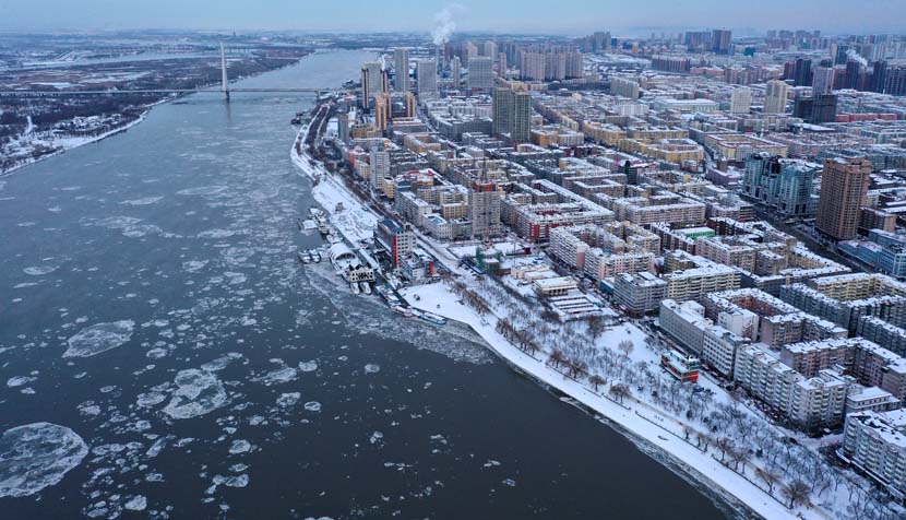 An aerial view of the Songhua River and the city of Harbin after heavy snowfall, Heilongjiang province, Nov. 21, 2020. People Visual