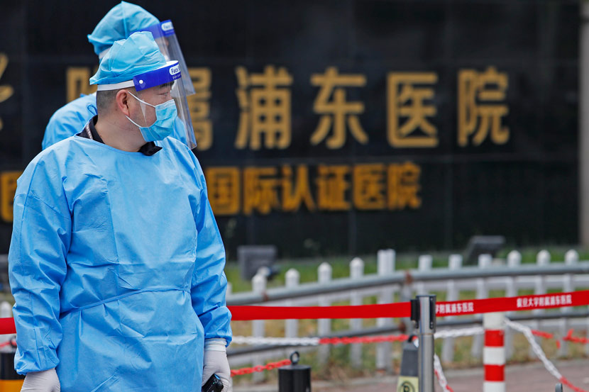 Medical staff wear personal protective equipment outside a hospital in Shanghai’s Pudong New Area, Nov. 21, 2020. Three local COVID-19 cases have been confirmed in the city since Nov. 20. Yin Liqin/CNS/People Visual