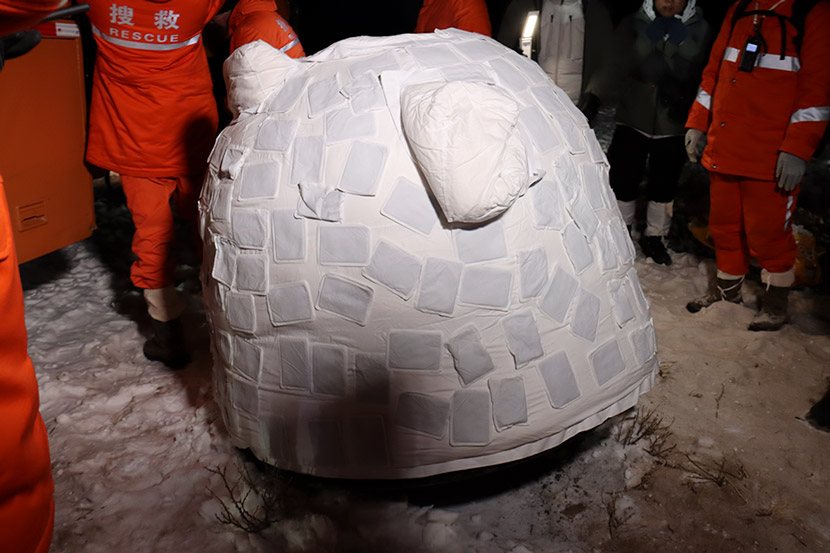 The Chang’e 5 return module after landing in the Inner Mongolia Autonomous Region, Dec. 17, 2020. The heating pads are to prevent any unspent fuel from freezing. Li Shuheng/China Space News via CNS