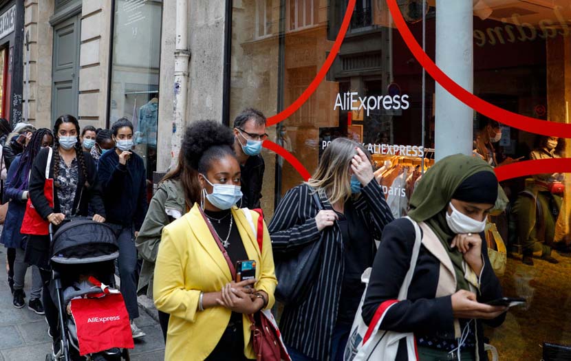 People line up in front of the AliExpress pop-up store in Paris, France, Sept. 24, 2020. The store aims to showcase its fashion and decoration products, as well as its concept of “shoppertainment” in video streams. Geoffroy Van Der Hasselt/People Visual
