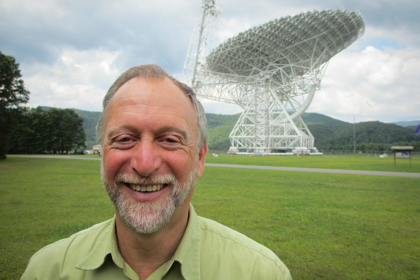Professor Dan Werthimer of University of California, Berkeley, poses for a photo in front of the Green Bank Telescope in West Virginia, 2012. Courtesy of Dan Werthimer.