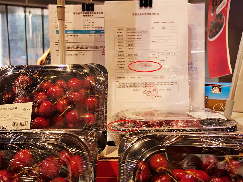 A sterilization report indicating that these cherries are safe to be sold at a supermarket in Guangzhou, Guangdong province, Feb. 1, 2021. People Visual