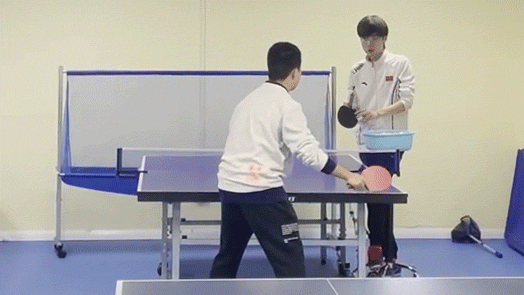 Li's son, a ninth-grader, takes a shot during his first ping-pong class, in Shanghai, 2021. Zhang Shiyu for Sixth Tone