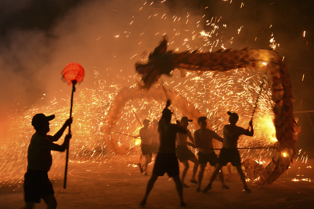 People perform a fire dragon show in rural Deyang, Sichuan province, Feb. 7, 2021. People Visual