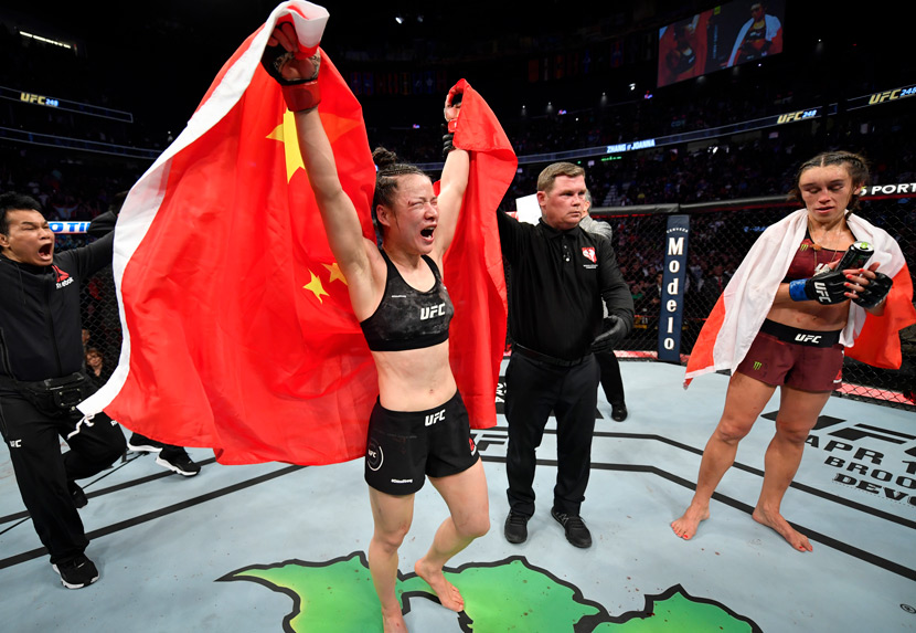 Zhang Weili celebrates following her split-decision victory over Joanna Jedrzejczyk of Poland in their UFC strawweight championship fight during the UFC 248 event in Las Vegas, USA, March 7, 2020. Jeff Bottari/Zuffa LLC/People Visual